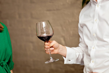 Man holding wine glass in his hand