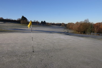 Frost on the greens of a golf course during early morning