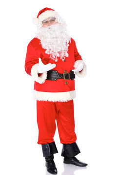 Santa Claus standing isolated on white background. Full length portrait