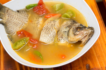 Carp gourami fish spicy soup with chili and herbs