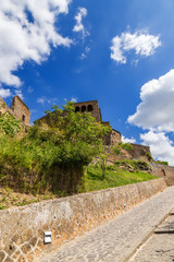 Fototapeta na wymiar Civita di Bagnoregio, Italy. Buildings at the entrance to the ancient city