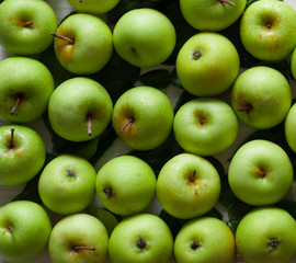 photo of fresh green apple on a white wooden