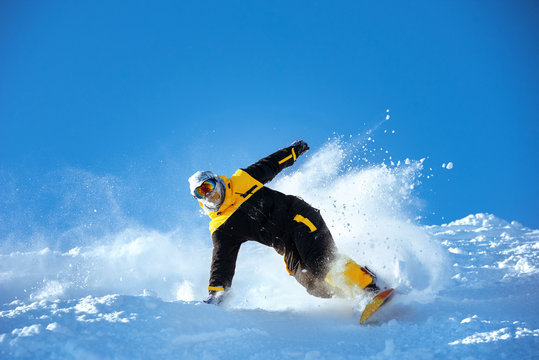 Snowboarder ski powder slope speed