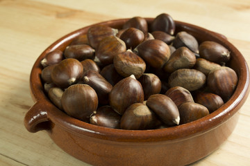 Chestnuts in an earthenware bowl.