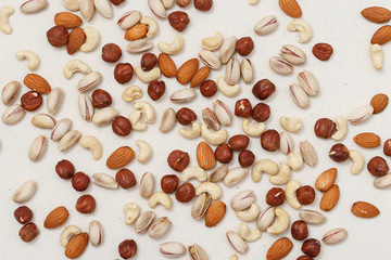 Composition of nuts pattern - mix hazelnuts, cashews, almonds, pistachios.