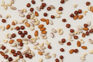 Composition of nuts pattern - mix hazelnuts, cashews, almonds, pistachios.