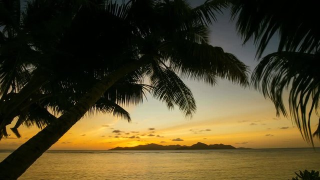 Time lapse of tropical beach in sunset