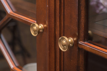 detail of decorated furniture drawers
