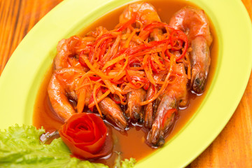 Shrimp prawn in sweet and sour sauce with carrot slices