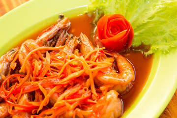 Shrimp prawn in sweet and sour sauce with carrot slices