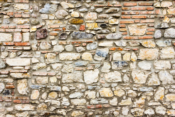 pattern gray color of modern style design decorative uneven cracked real stone wall surface with cement.