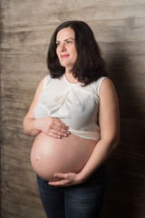 Pregnant woman in a white blouse