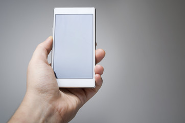 Male hand holding smart phone device