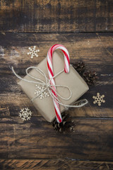 Christmas gift on brown wooden background