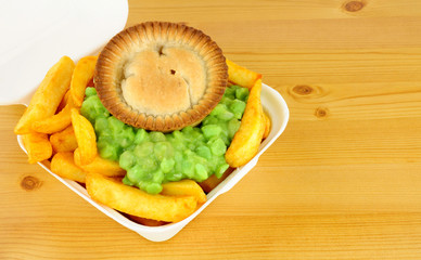 Meat Pie And Chips In Take Away Box