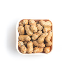 Peanuts pile. Shell Seeds into a bowl