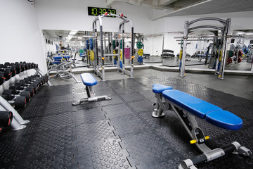 Fototapeta premium Interior of a fitness hall with fitness equipment