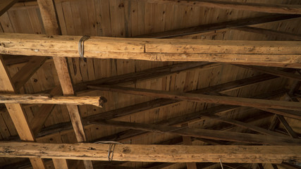 Interior view of a wooden roof structure in old building