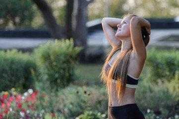 young girl resting in the summer park