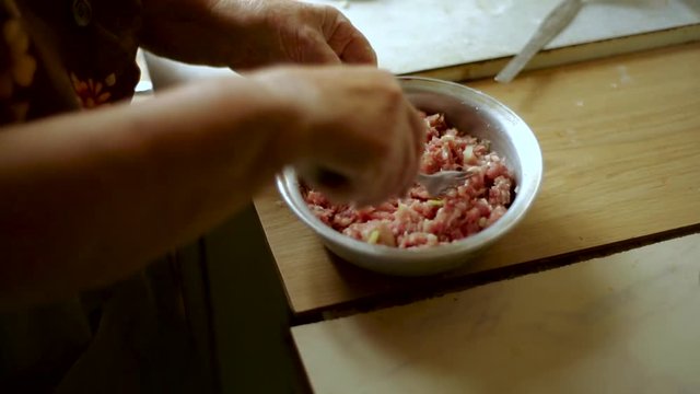Preparation of belyashes. Traditional russian meat pies belyashi. belyashes on a table. Russian, Bashkir and Tatar cuisine.