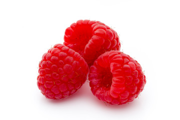 Ripe raspberry with leaf isolated on the white background.