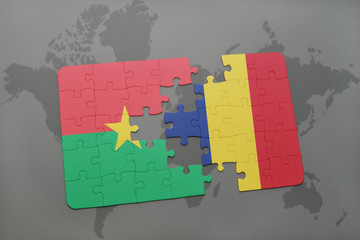 puzzle with the national flag of burkina faso and chad on a world map