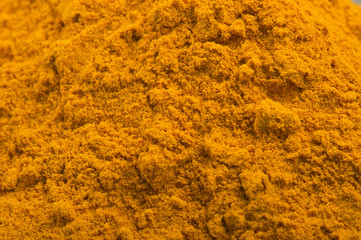 dust of ground turmeric on the white
