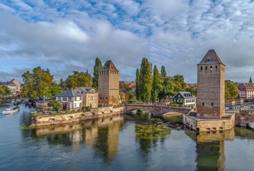 Obraz premium Panoramic view of Ponts Couverts and medieval towers over the Ill river in Strasbourg, Alsace, France.