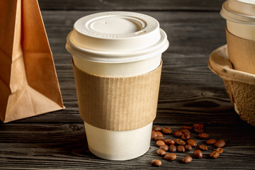 coffee cup to go at wooden background