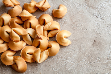Many Chinese fortune cookie close up on concrete background