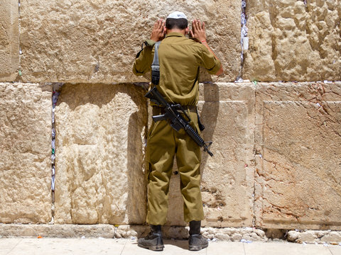 Man with tefillin praying at the Wailing Wall, Jerusalem