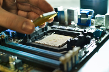 Fototapeta na wymiar Installing the CPU into the motherboard