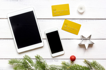 smartphone, tablet, shopping for new year online wooden table