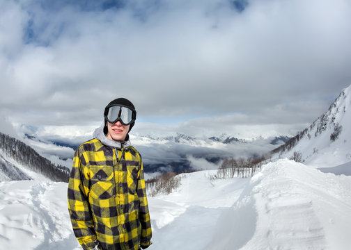 Snowboarder on background landscape of mountains