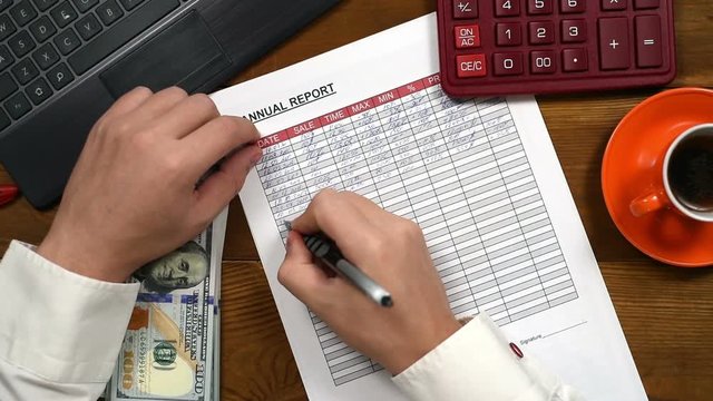 Accountant Man Fills Financial Report. Slow Motion Effect