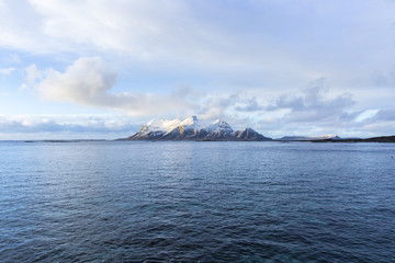 View of a Norwegian fjord with snowy mountains, Nordland, Norway