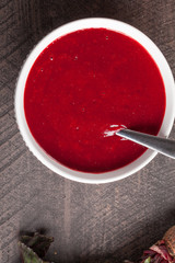 Potato and beet red borscht soup with freshly picked organic vegetables top view close