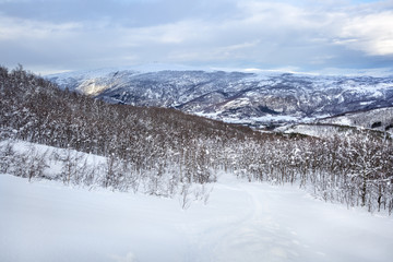 Fototapeta na wymiar Snowy Norwegian mountain landscape, Nordland, Norway