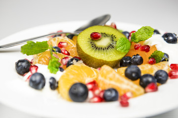 Delicious tasty exoctic fruit salad with yoghurt