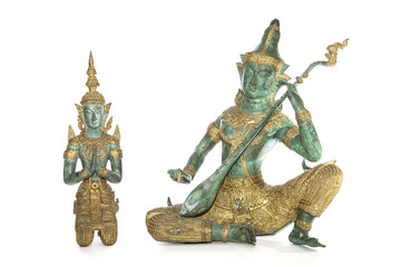 Traditional Thai bronze statues isolated against a white background. Musician and Temple Guardian.