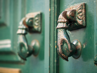 Old decorative metal door handle with ornaments in Lisbon
