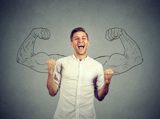Successful man winning fists pumped celebrating success flexing muscles