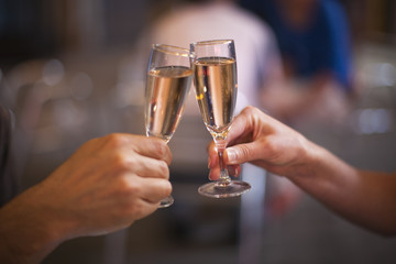 Celebration: cheering with a glass of champagne