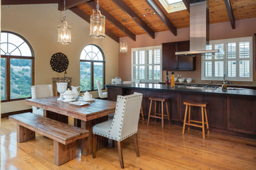 Amazing Wooden Kitchen with dark wood cabinets and island in mediterranean style.