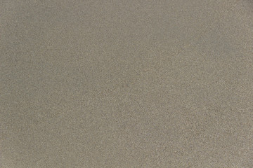 Fototapeta premium Sand texture. Beach sand. The yellow tone is common in some beaches. 