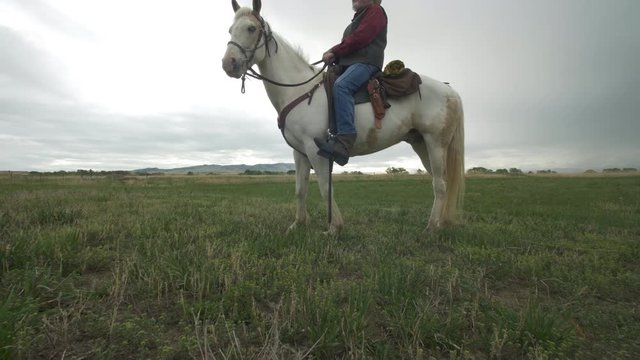 Senior cowboy on Horse - Wide - Dolly Left up