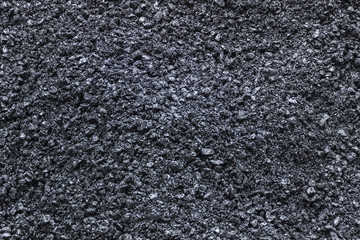 Pitch. Details of grains of pitch shining in the sun.