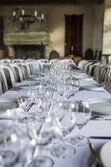 Table set for an event party or wedding reception in a old medieval castle room