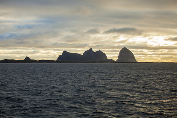 Norwegian landscape, view of the Traena and Sana islands under midnight sun, Norway