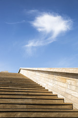 wooden staircase leading to a cloud